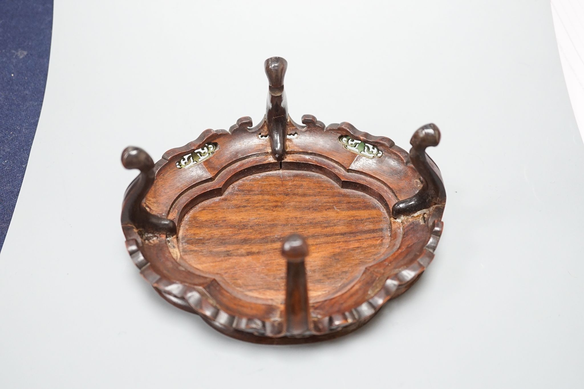 A fine Chinese oval hardwood and green stained Ivory inset stand, Qing dynasty, lacking stretcher, 15 cms wide.